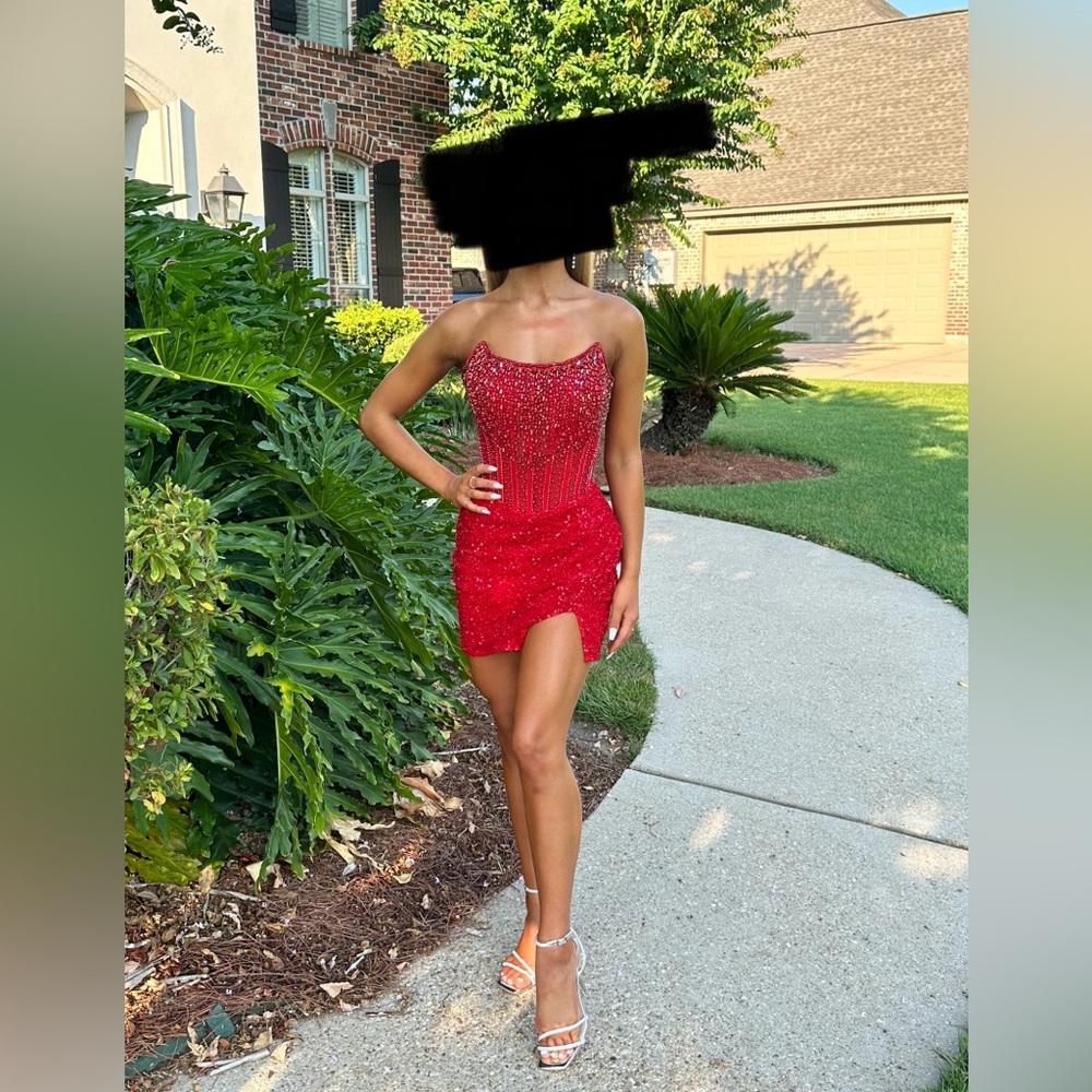 Ashley Lauren 4564 Strapless cocktail dress with exposed boning.